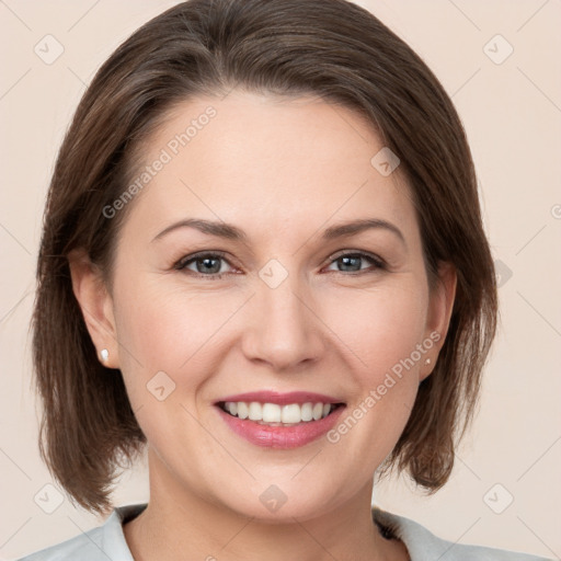 Joyful white young-adult female with medium  brown hair and grey eyes