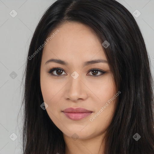 Joyful latino young-adult female with long  black hair and brown eyes