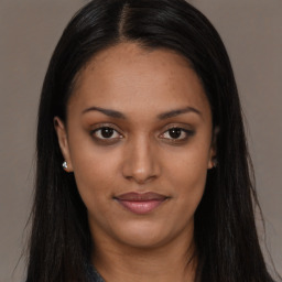 Joyful asian young-adult female with long  brown hair and brown eyes