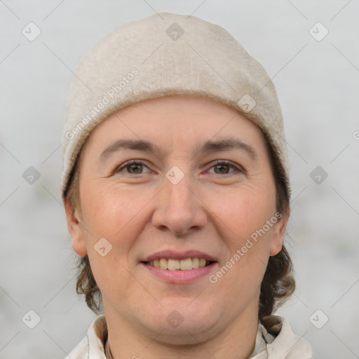 Joyful white adult female with short  brown hair and brown eyes