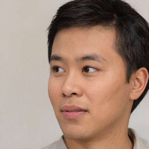 Neutral asian young-adult male with short  black hair and brown eyes