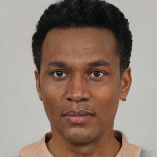 Neutral black young-adult male with short  black hair and brown eyes