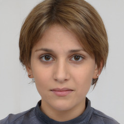 Neutral white young-adult female with medium  brown hair and brown eyes