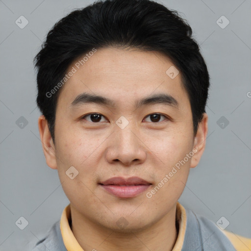 Joyful asian young-adult male with short  brown hair and brown eyes