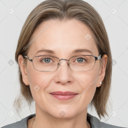 Joyful white adult female with medium  brown hair and grey eyes