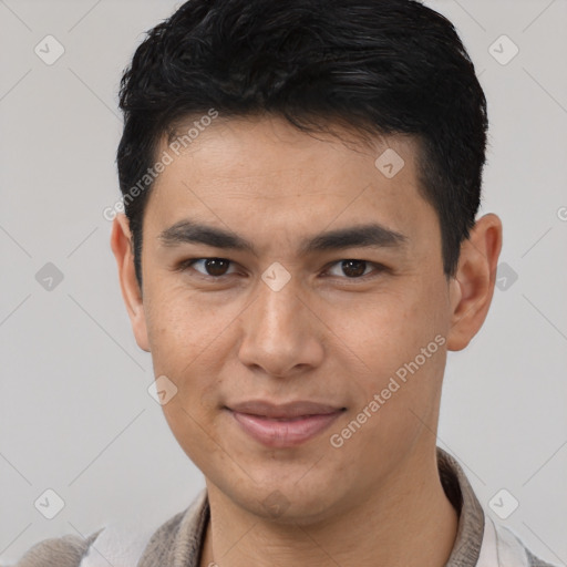 Joyful latino young-adult male with short  brown hair and brown eyes