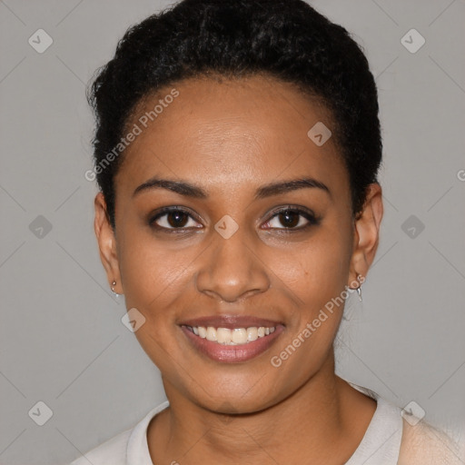 Joyful black young-adult female with short  black hair and brown eyes