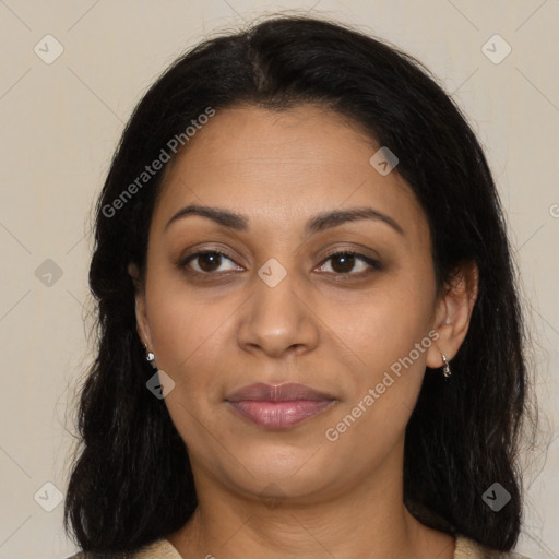 Joyful latino young-adult female with long  brown hair and brown eyes