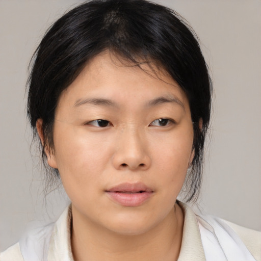 Neutral asian young-adult female with medium  black hair and brown eyes