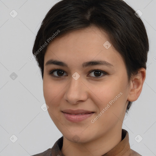 Joyful latino young-adult female with short  brown hair and brown eyes