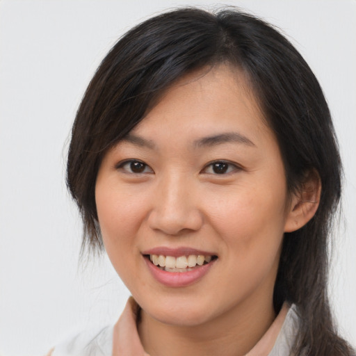 Joyful white young-adult female with medium  brown hair and brown eyes