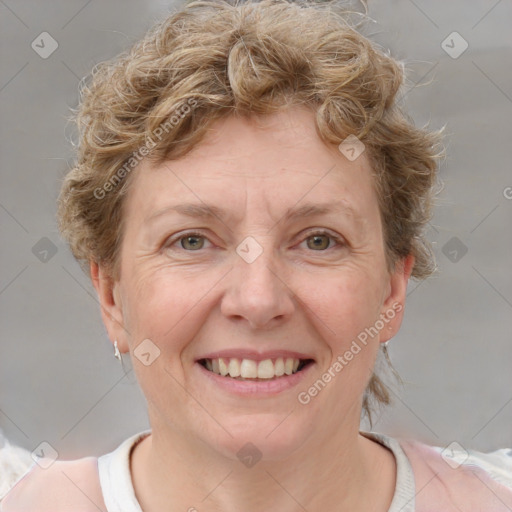 Joyful white adult female with short  brown hair and grey eyes