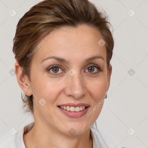 Joyful white adult female with medium  brown hair and brown eyes