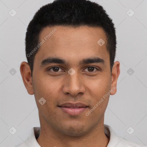 Joyful latino young-adult male with short  black hair and brown eyes