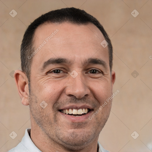 Joyful white adult male with short  brown hair and brown eyes