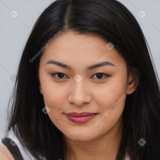 Joyful asian young-adult female with long  brown hair and brown eyes