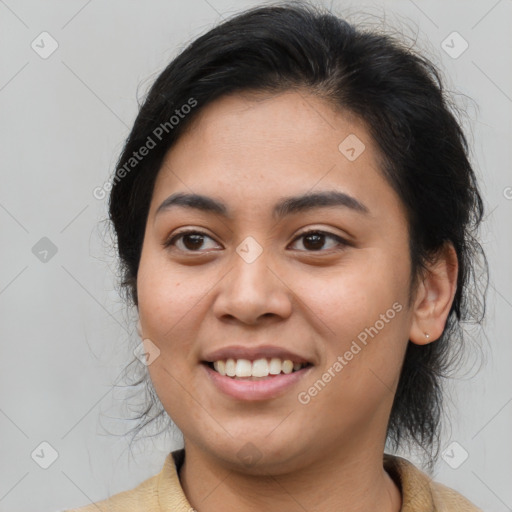 Joyful latino young-adult female with medium  brown hair and brown eyes