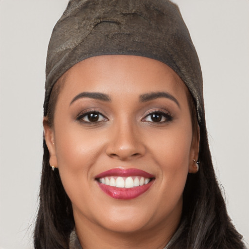 Joyful white young-adult female with long  black hair and brown eyes