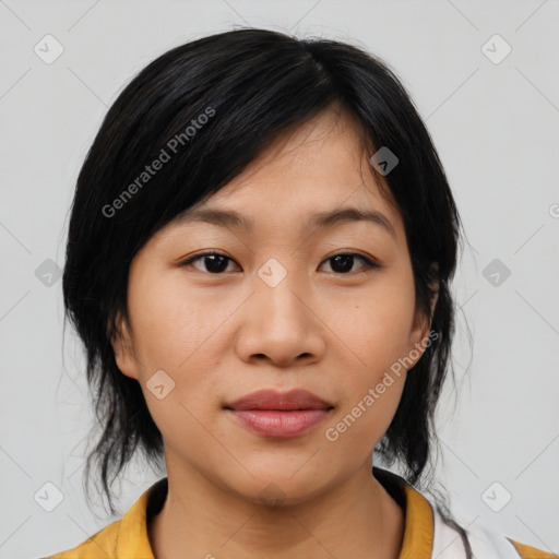 Joyful asian young-adult female with medium  black hair and brown eyes