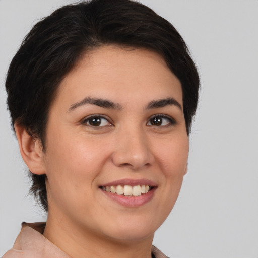 Joyful white young-adult female with short  brown hair and brown eyes