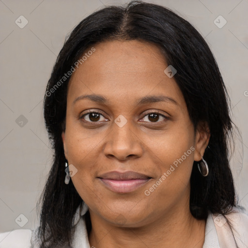 Joyful black adult female with medium  brown hair and brown eyes