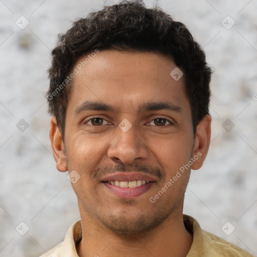 Joyful latino young-adult male with short  black hair and brown eyes