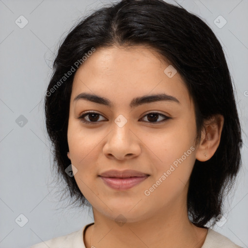 Joyful latino young-adult female with medium  black hair and brown eyes