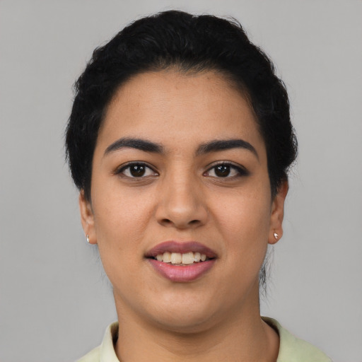 Joyful asian young-adult female with short  black hair and brown eyes