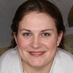 Joyful white adult female with medium  brown hair and brown eyes