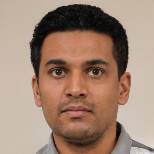 Neutral latino young-adult male with short  black hair and brown eyes
