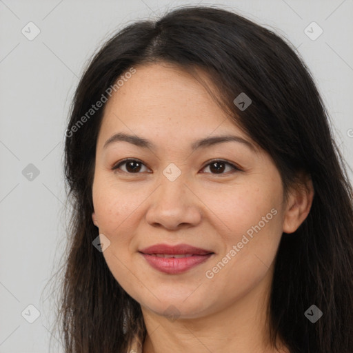 Joyful asian young-adult female with long  brown hair and brown eyes