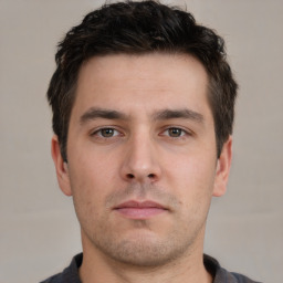 Neutral white young-adult male with short  brown hair and brown eyes