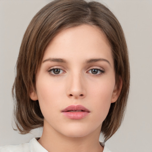 Neutral white young-adult female with medium  brown hair and brown eyes