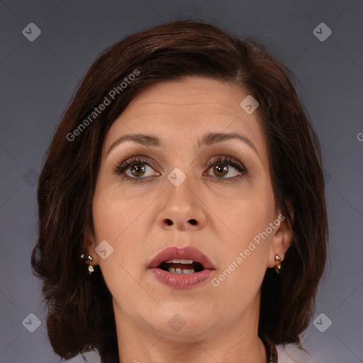 Joyful white adult female with medium  brown hair and brown eyes