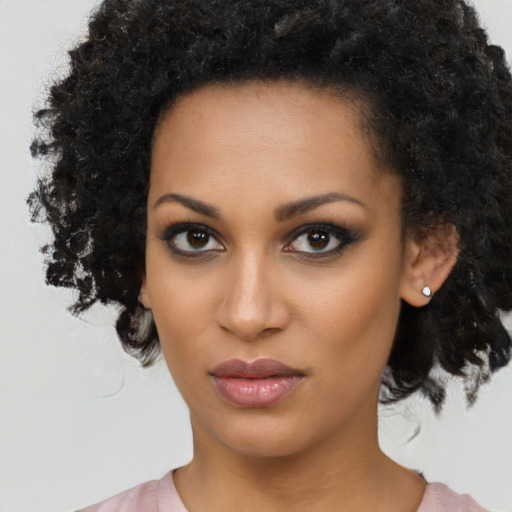 Neutral black young-adult female with medium  black hair and brown eyes