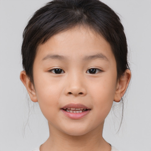 Joyful asian child female with medium  brown hair and brown eyes