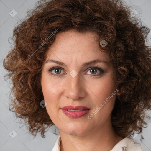 Joyful white adult female with medium  brown hair and brown eyes