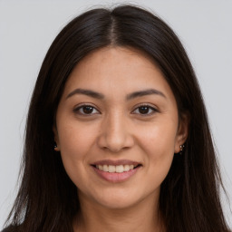 Joyful white young-adult female with long  brown hair and brown eyes