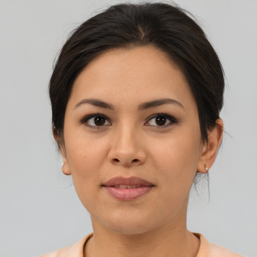 Joyful asian young-adult female with medium  brown hair and brown eyes