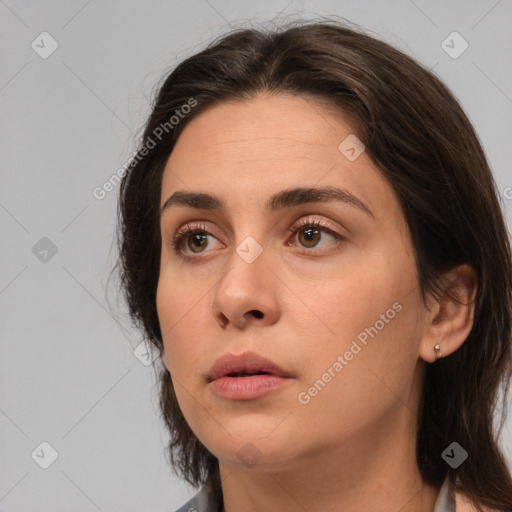 Neutral white young-adult female with medium  brown hair and brown eyes