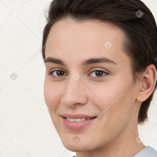 Joyful white young-adult female with short  brown hair and brown eyes