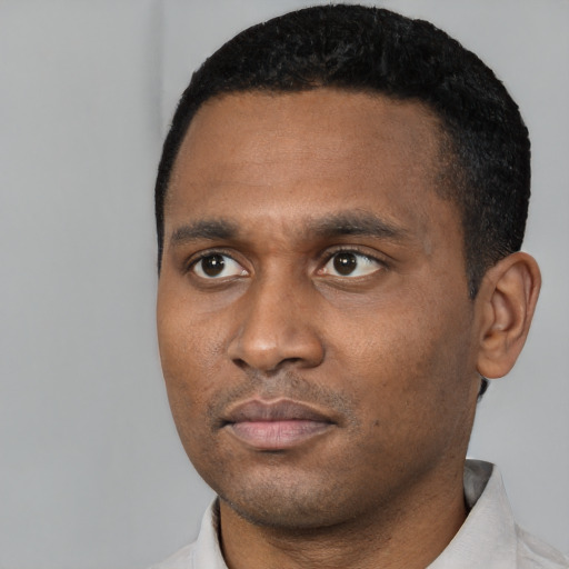 Neutral black young-adult male with short  black hair and brown eyes