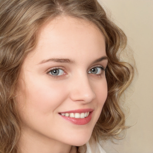 Joyful white young-adult female with long  brown hair and green eyes