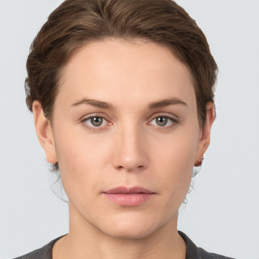 Neutral white young-adult female with short  brown hair and grey eyes