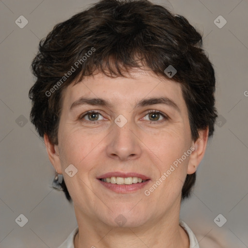 Joyful white adult female with short  brown hair and brown eyes