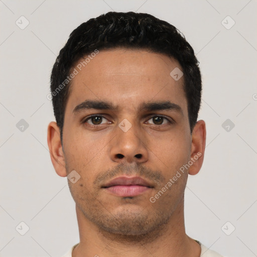 Neutral latino young-adult male with short  black hair and brown eyes