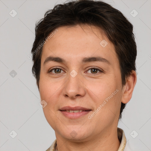 Joyful white adult female with short  brown hair and brown eyes