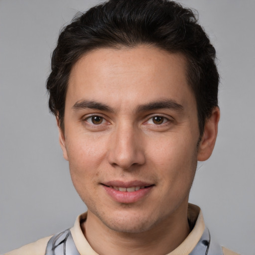 Joyful white young-adult male with short  brown hair and brown eyes