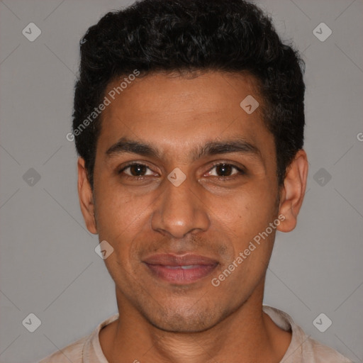 Joyful latino young-adult male with short  black hair and brown eyes