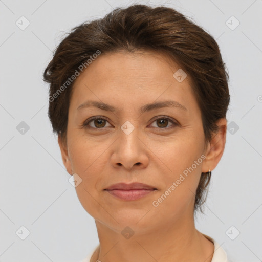 Joyful white adult female with short  brown hair and brown eyes